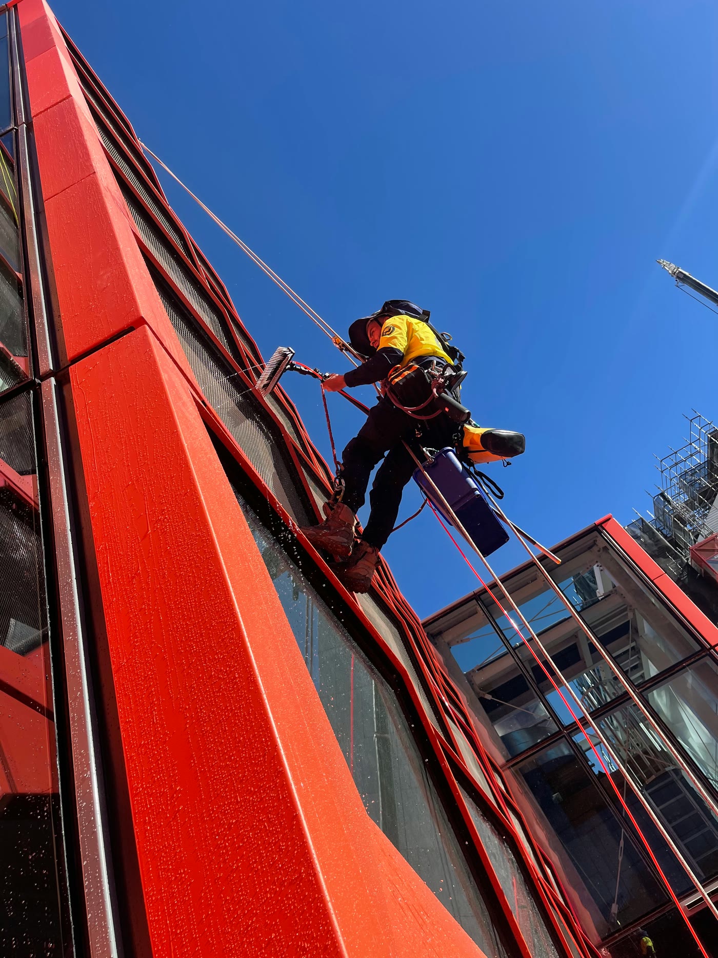 Technician on a red façade