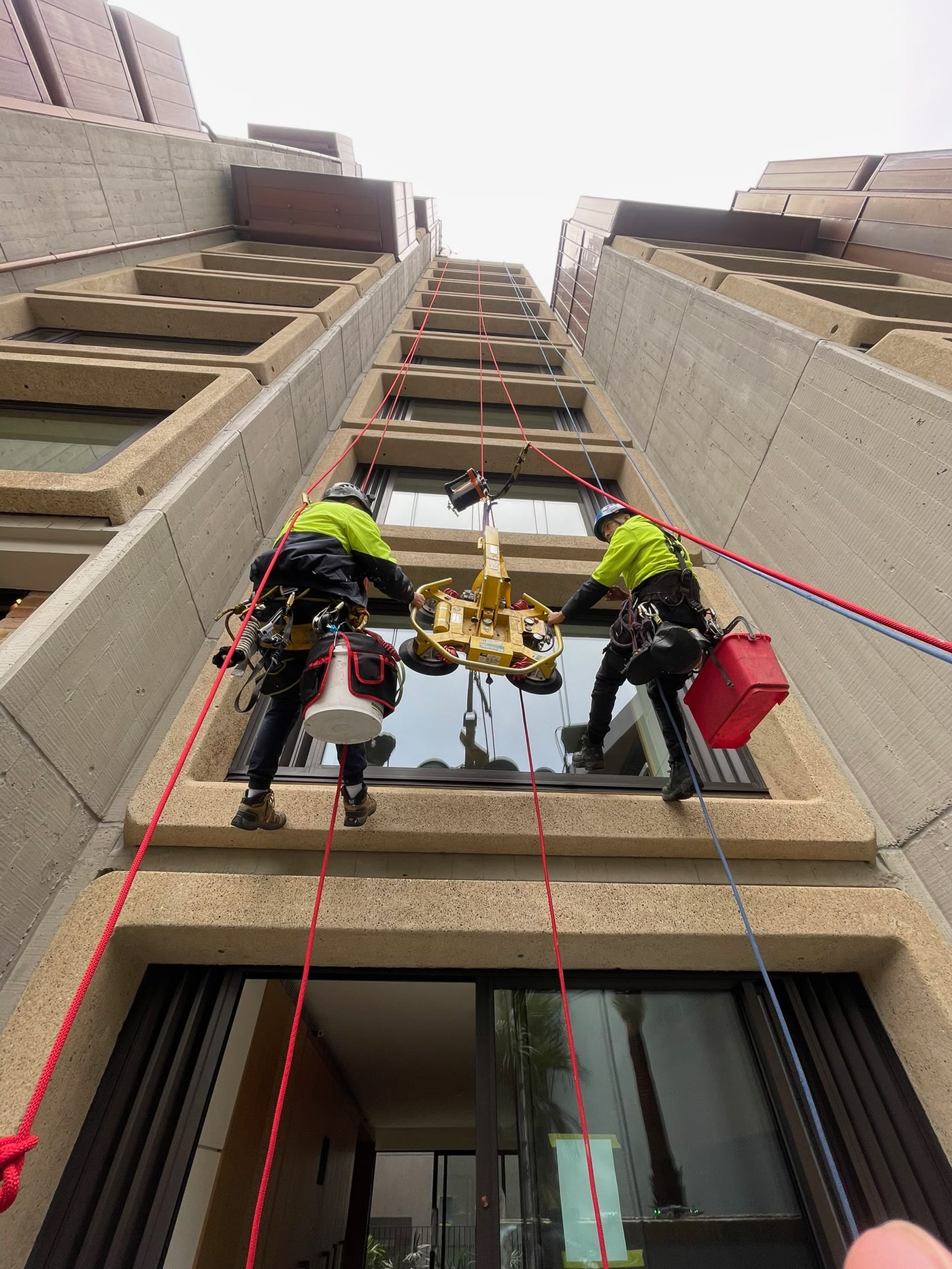 Glass panel installation on ropes